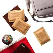 Frosted brown sugar cinnamon Pop-Tarts with gray bag, notebook, and pens