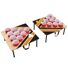Portable cup pong toss game set with two folding boards, pink cups, and balls