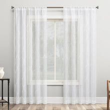Sheer white trellis embroidered curtains on window, grommet top