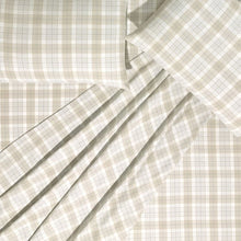 Close-up of beige plaid cotton flannel sheets and pillowcases