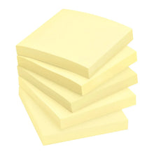 Canary yellow Post-it sticky note pads stacked on white