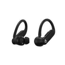 Powerbeats Pro 2 black earbuds, side view with eartip and charging contact flap