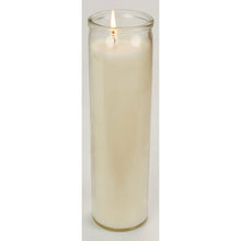Prayer candle in clear glass with white wax, lit flame