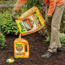Weed preventer refill bottle and granular bag in use at a garden planting bed