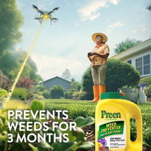 Preen Garden weed preventer plus plant food container in hand while treating lawn