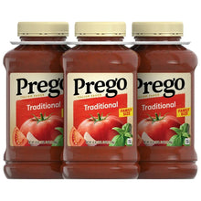 Three Prego Traditional Italian sauce jars with red tomato sauce and cream caps