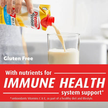 Premier Protein carton pouring shake into a glass, bananas & cream flavor