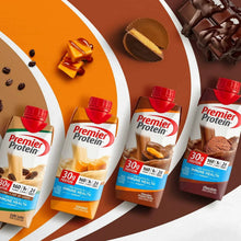 Assorted Premier Protein shake cartons with red caps on striped display