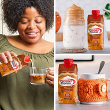 Pumpkin spice protein shake carton held with glass of creamy shake and tabletop bottle