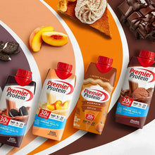 Pumpkin spice and chocolate protein shake cartons arranged with red caps