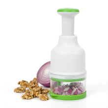 Food chopper with white body and green lid, clear chopping bowl