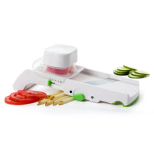 White kitchen multi slicer with clear guard and green control handles