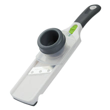 Mini mandoline slicer with dark handle, clear base, and safety guide
