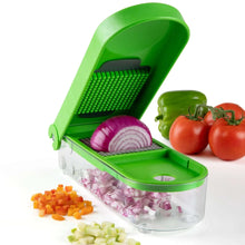 Green onion chopper with grating grid and clear base, showing onion pieces