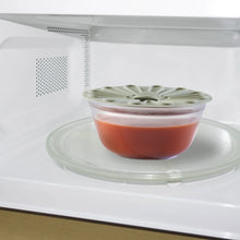 Silicone food storage lid, light green with vented radial design