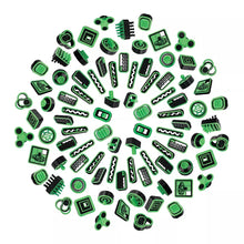 Assorted removable green fidget pieces with different textured shapes and icons