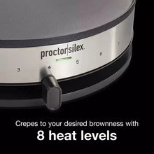 Close-up of crepe maker control dial area with heat level settings and black handle