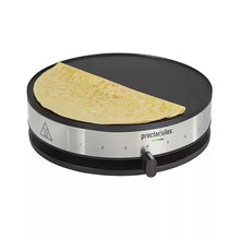 Crepe maker with black lid, yellow crepe on round nonstick surface, silver control panel