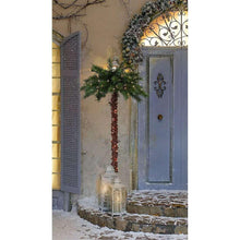 Lighted palm tree decoration with green fronds and warm lights on textured trunk