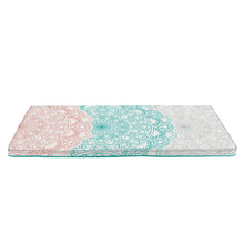 Memory foam rollout lounger with teal and coral mandala print, rolled out flat