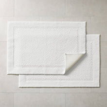 White bath rug 2-pack with layered look and textured low-pile surface