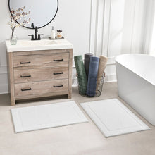 White bath rug 2-pack, textured square mats with stitched border