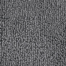Dark gray towel fabric close-up with textured looped pile
