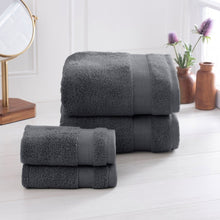 Dark gray towel set with two folded towels and a smaller matching hand towel