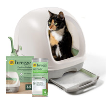 Hooded cat litter box with gray base, open door, and a calico cat sitting inside.