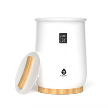 White towel warmer with wooden base, side door open, and digital temperature display