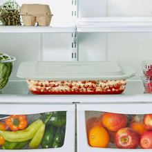 Clear deep glass baking dish with lid stored in refrigerator
