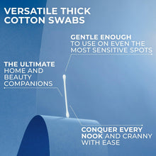 Cotton swab with long white cotton tip on a paper stem