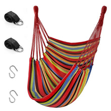 Hanging hammock chair with multicolor striped fabric and red rope suspension