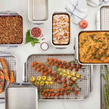 Wire rack insert placed on baking tray, supporting roasted food in oven