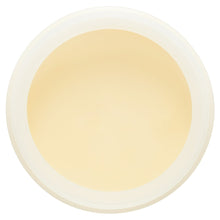 Cream surface in Queen Helene Cocoa Butter Crème jar, top view