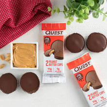 Tray with peanut butter and peanut butter cups alongside Quest 2-pack pouch