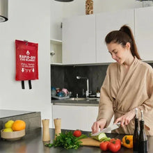 Red fire blanket pouch mounted on kitchen wall above countertop