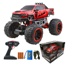 Red 1:10 RC monster truck with 4x4 shocks, large black wheels with red rims