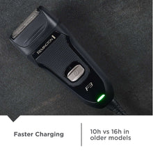 Electric foil shaver angled view, black with green status light
