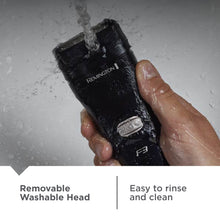 Electric foil shaver rinsed with water, black body and washable head