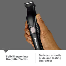 Black REMINGTON trimmer held upright with blade housing visible