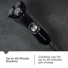 Black rotary shaver with three shaving heads and pop-up trimmer on the front