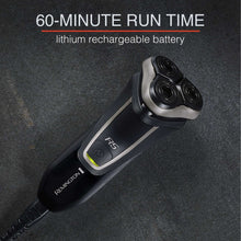 REMINGTON R5 rotary shaver lying on textured surface, black handle with silver side strip