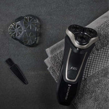 REMINGTON R5 rotary shaver with detachable pieces and cleaning attachment