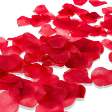 Artificial red rose petals, scattered