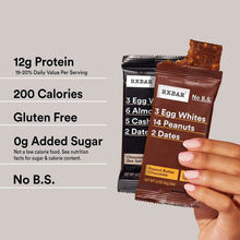 Hand holding an RXBAR protein bar; no B.S. label and 12g protein
