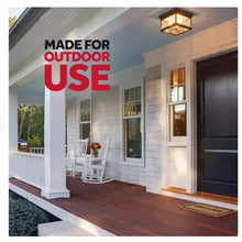 Porch exterior with red 'MADE FOR OUTDOOR USE' text above wooden entry steps