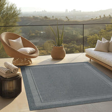 Indoor/outdoor rug with geo border in silver-gray, flat-woven textured center
