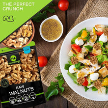 Bag of raw walnuts with a plate of salad and scattered walnut pieces