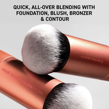 Rounded blending brush head with white bristles on a rose-gold handle.